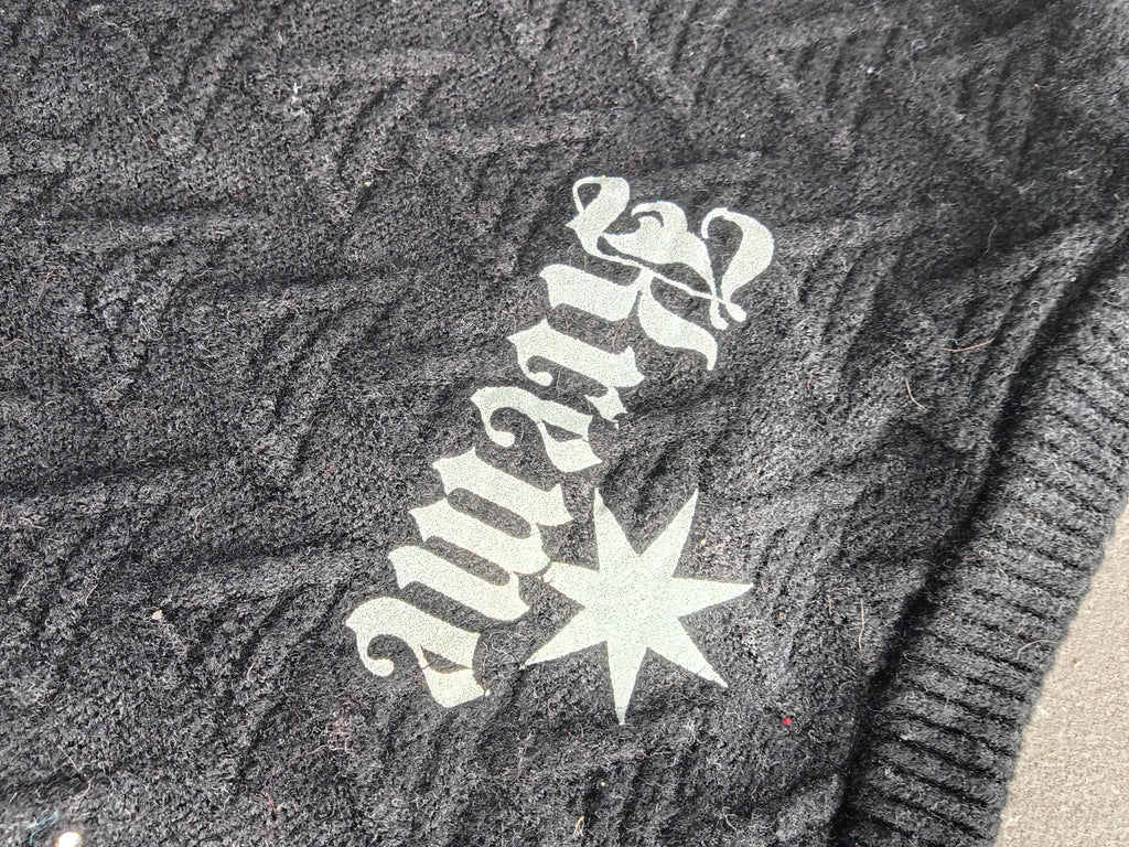 Kreme Vest distressed knit texture close-up